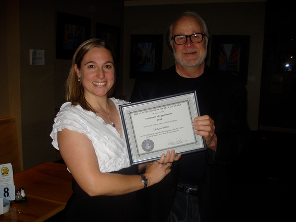 Li-Ann Skibo gets certificate of thanks for her work as treasurer from Nelson Walker