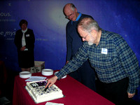 Jim Hesser cutting the cake