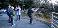 Diane Bell, Colin Scarfe and Barbara Lane chat while Michael Webb takes photos of the sunset from the VCO observing pad
