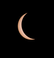 Crescent shaped partially eclipsed Sun before Totality