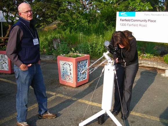 John McDonald shares a view of the sun with a visitor