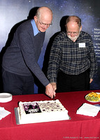 John McDonald and Jim Hesser cut the IYA cake