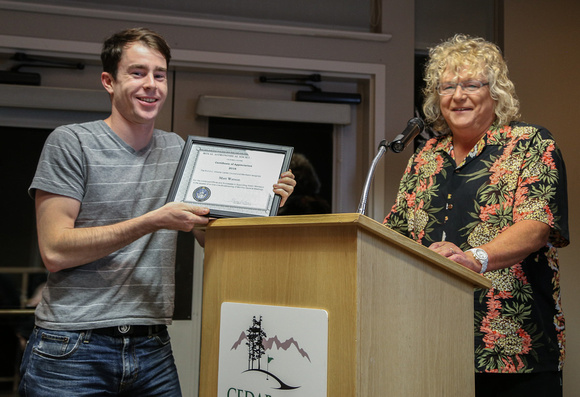 Matt Watson receives his Certificate of Appreciation for the live broadcasts of the meetings from Sherry Buttnor
