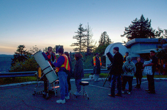 People looking through telescopes