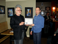 Nelson Walker presents service certificate to Charles Banville