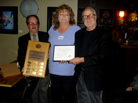Sherry Buttnor receives Newton Ball Service Award from Bruno Quenneville and Nelson Walker