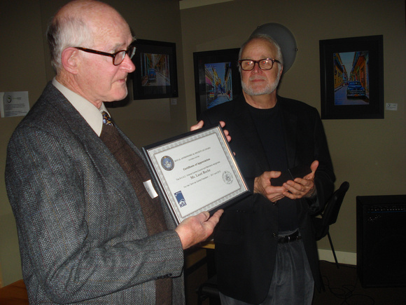 John McDonald receives service certificate on behalf of Lauri Roche from Nelson Walker