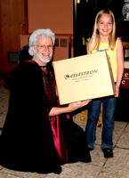 The Wizard presents the kids' telescope prize to our lucky winner