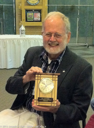 Dr. Jim Hesser displays his RASC Service Award