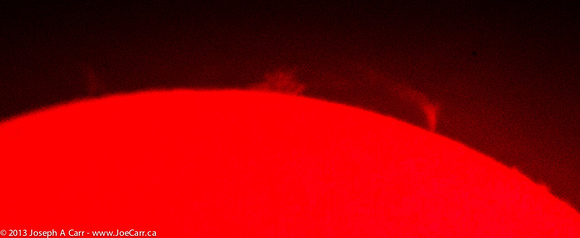 Huge looping solar prominence & large exploding haystack shaped prominence