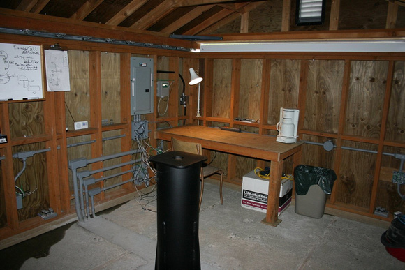 Interior view including work bench, pier and wiring