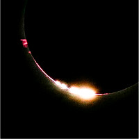Bailey's Beads and solar prominences just after totality started