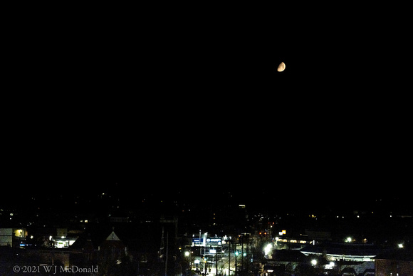 Crescent moon over City