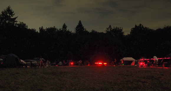 Camping and telescopes on the observing field at night