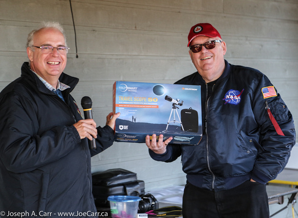 Chris Purse awards the travel solar telescope to Chris Gainor