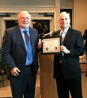 Vice President Reg Dunkley receiving an award from President Chris Purse