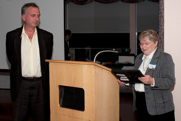 Lauri Roche presents a Volunteer Appreciation Certificate to Mark Bohlman