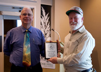 Ken Mallory receiving his Special Award Plaque of Excellence for his dedication as Outreach Coordinator from Chris Purse