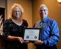 Certificate of Excellence presented to outgoing President Chris Purse by Sherry Buttnor