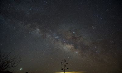 Pre-dawn Sagittarius area of the Milky Way with Venus, Saturn and Jupiter over the Dragoon Mountains in southern Arizona