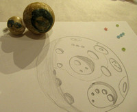 Some of Diane's simple artwork - moon craters - and a tiny "Ultima Thule" model, made of styrofoam.