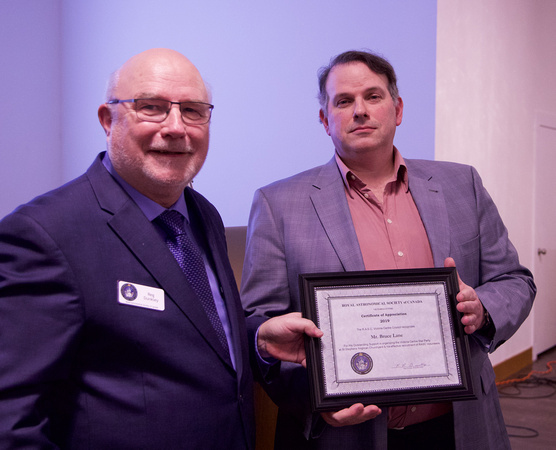 Reg presenting Bruce Lane with a Certificate of Appreciation