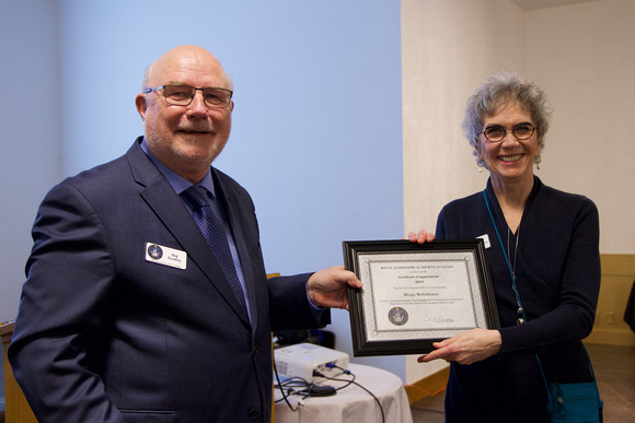 Reg presenting Marjie Welchframe with a Certificate of Appreciation
