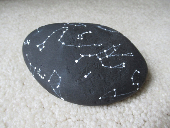 Painted constellations on a rock