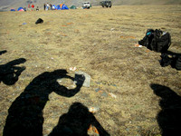 Mongolia. Total Eclipse 2008: Crescent images of eclipsed sun projected through crossed fingers - no vegetation above grass height!