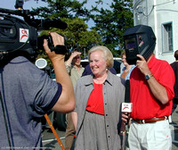 Ed Bain hams it up for the TV camera while Helen Hughes stands by
