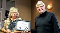 Nelson Walker receives his Certificate of Appreciation for public outreach at the DAO from Sherry Buttnor