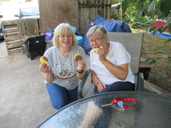 Diane and Lauri enjoying an eclipse cookies made by Diane